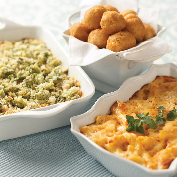 Side sampler with Broccoli Parmesan Gratin, Macaroni and Cheese, and Sweet Corn Hush Puppies.