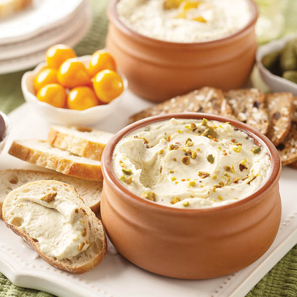 Gourmet Cheese Spreads, featuring Blue Cheese with Fig Compote and Pistachios, and Vintage Cheddar with Balsamic Caramelized Onions.