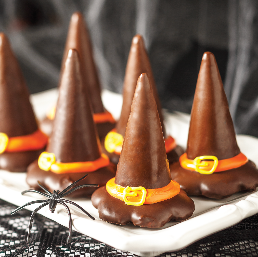Chocolate truffle hats on a spider net Halloween themed table