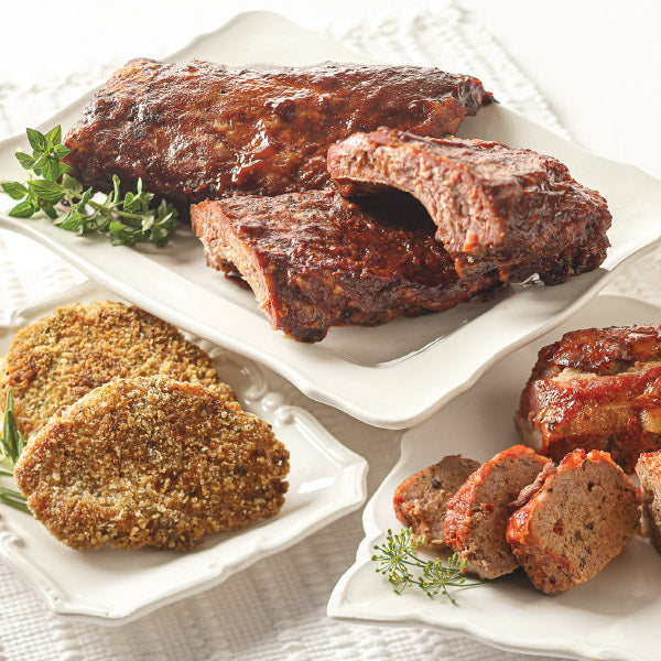 Top-Rated Entree Sampler, featuring Baby Back Pork Ribs (top), Pork Schnitzel (left), and Individual Classic Meatloaf (right).